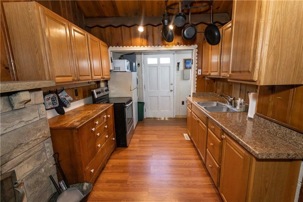 526 Nebo Road Champion, PA 15622 - Photo 5 of 30 a kitchen with stainless steel appliances granite countertop a sink a stove and a wooden floors