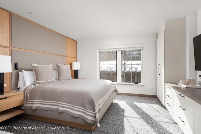 a kitchen with stainless steel appliances kitchen island granite countertop a sink and a stove