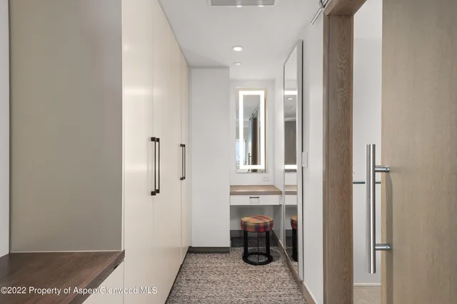 a bedroom with a bed and lamp