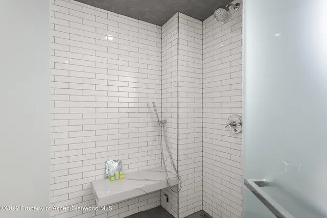 a bathroom with a bathtub and a sink