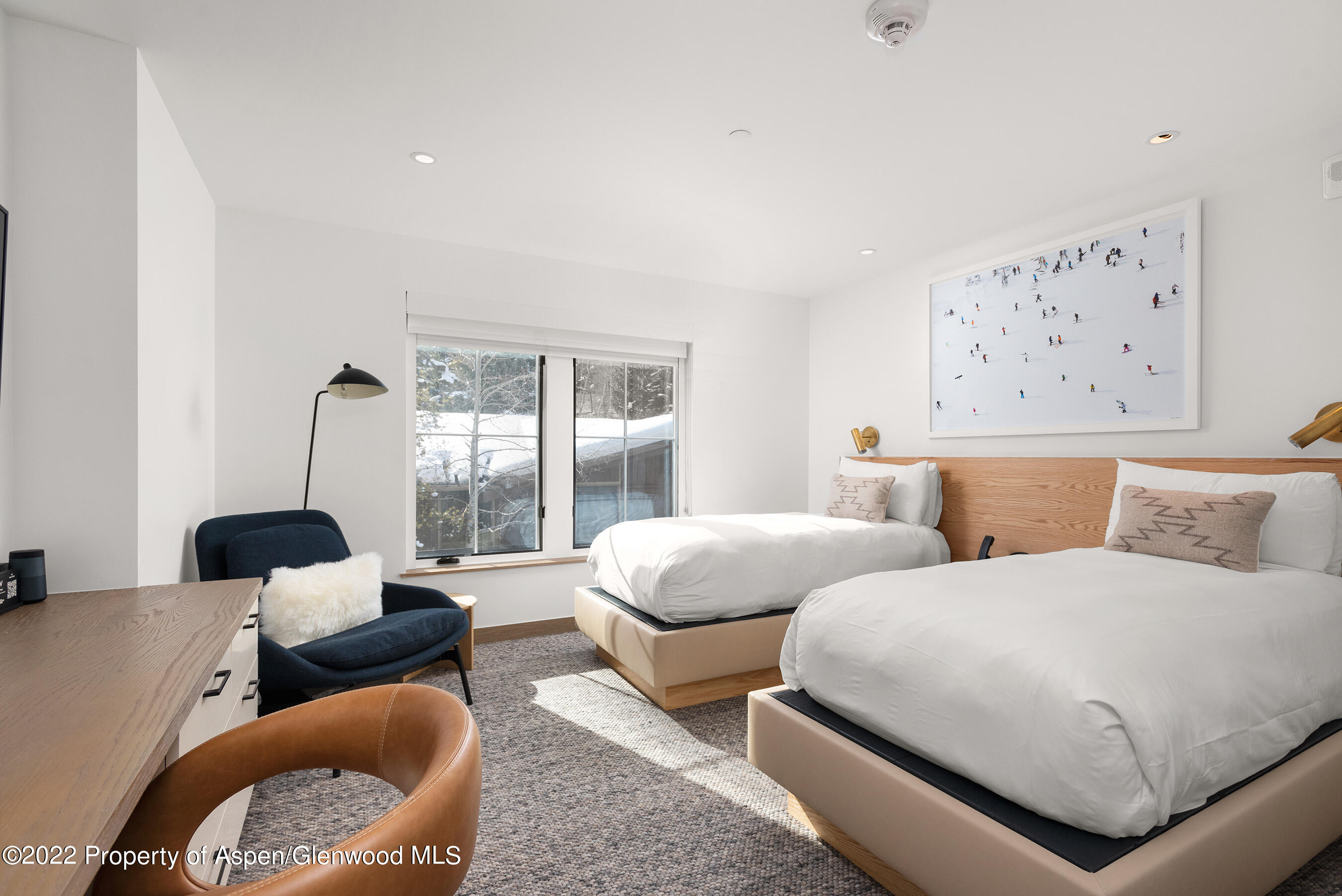 550 South Spring Street, Unit 392 Aspen, CO 81611 - Photo 20 of 41 a bedroom with two beds and a large window