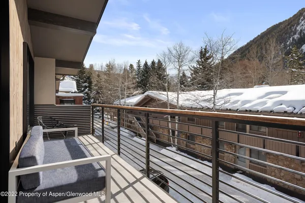 a terrace of a house with outdoor seating