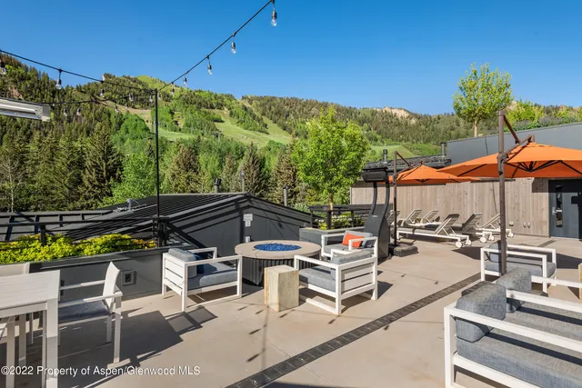 a view of a chairs and table in patio