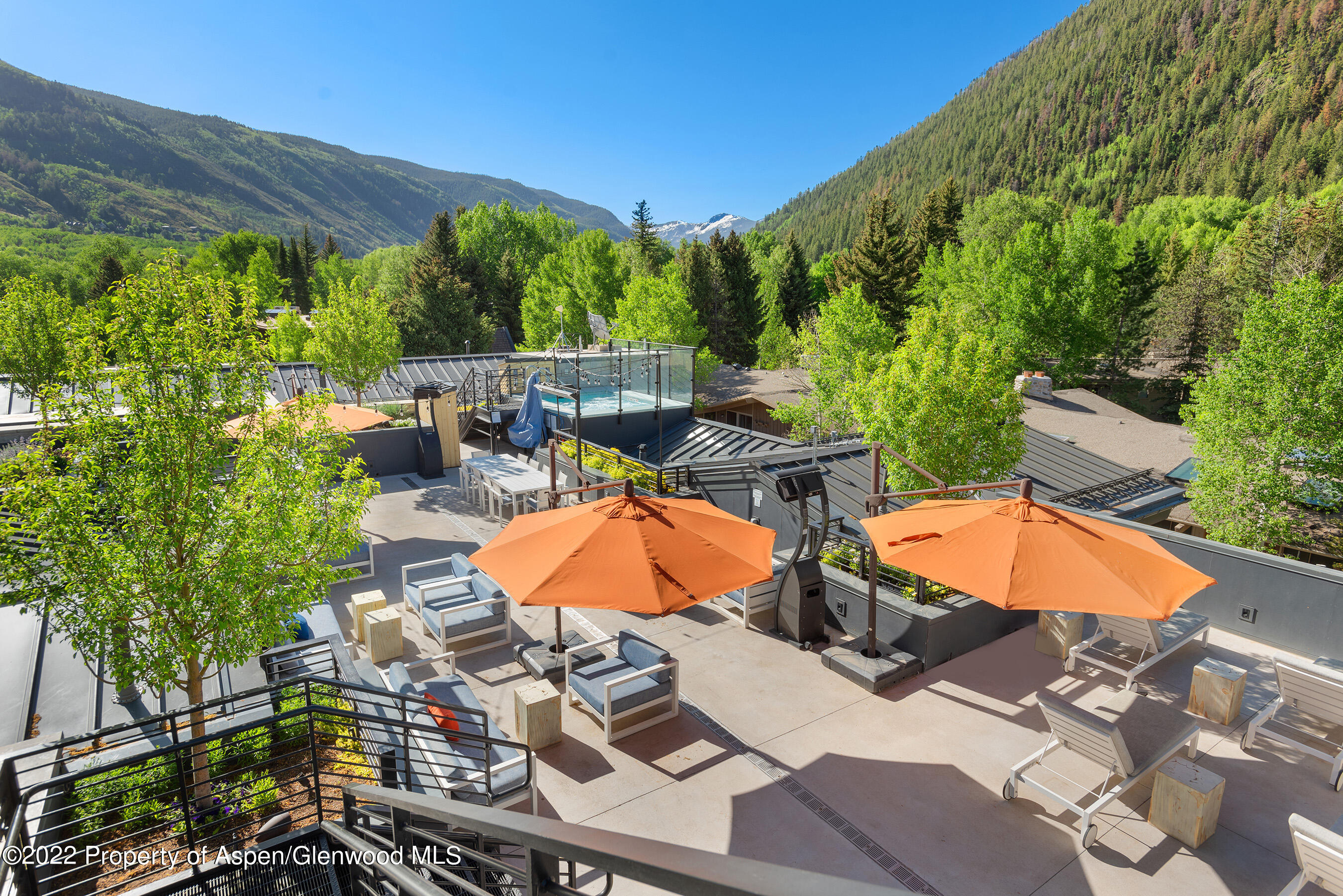 550 South Spring Street, Unit 392 Aspen, CO 81611 - Photo 33 of 41 an aerial view of a house with swimming pool and trees