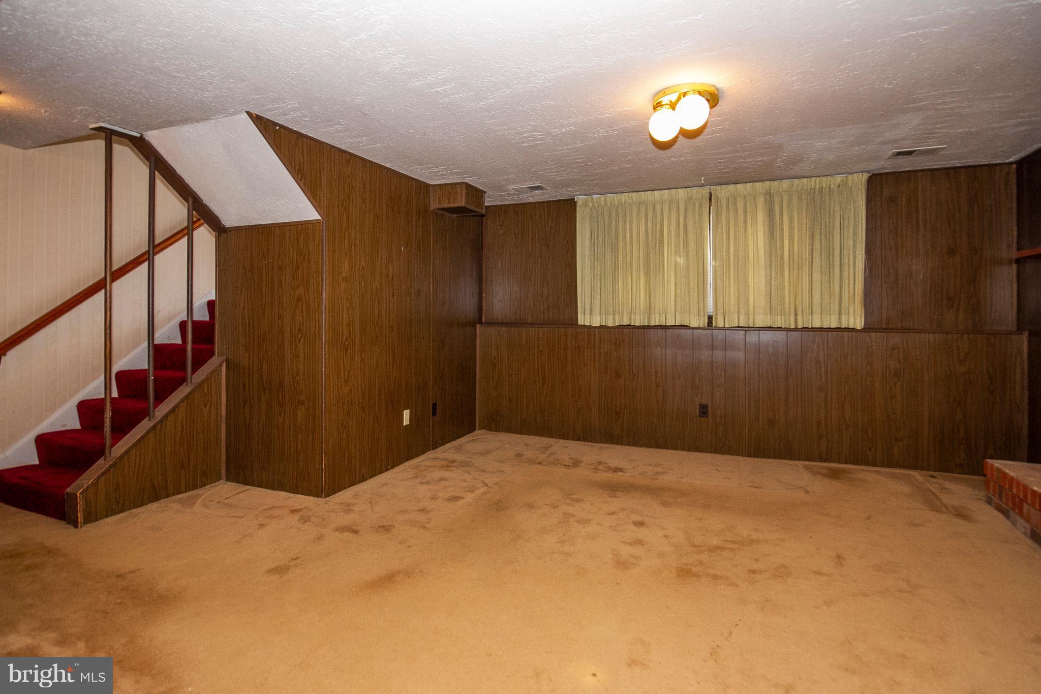 7203 Pinecrest Road Baltimore, MD 21228 - Photo 22 of 30 a view of an empty room with stairs