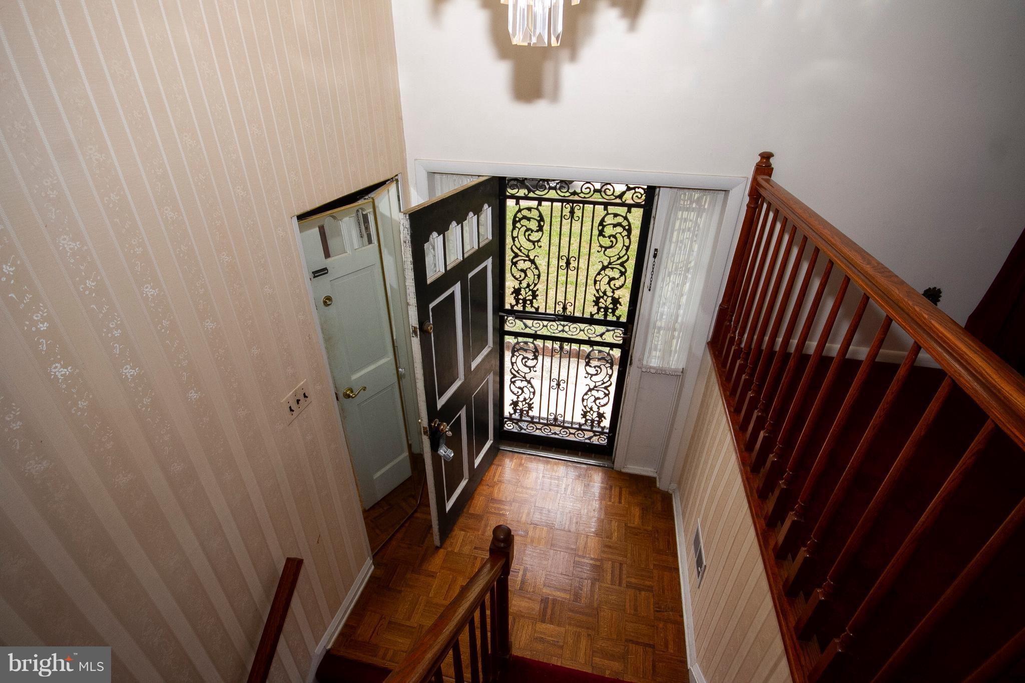 7203 Pinecrest Road Baltimore, MD 21228 - Photo 5 of 30 a view of entryway with stairs and wooden floor