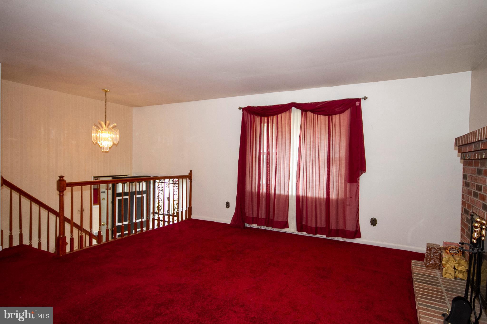 7203 Pinecrest Road Baltimore, MD 21228 - Photo 8 of 30 a view of a room with a window and ceiling fan