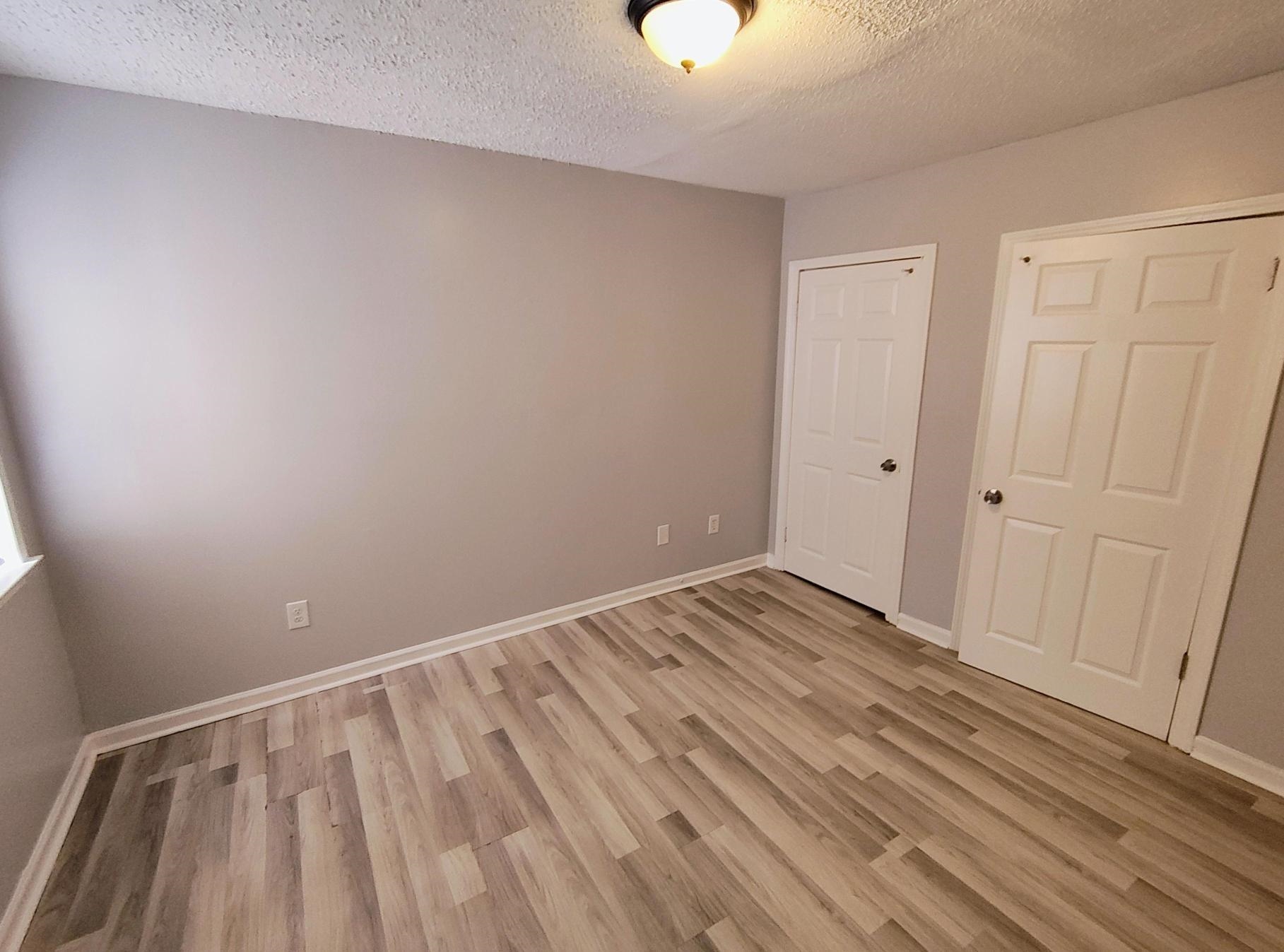 6439 Kirby Trees Drive, Unit 6439 Memphis, TN 38115 - Photo 7 of 17 a view of room with wooden floor