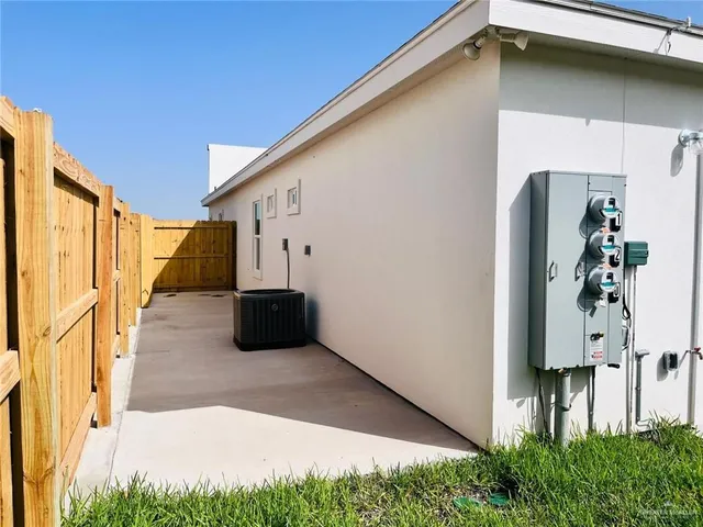 a view of a back yard from a balcony