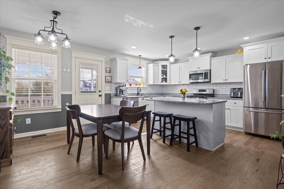 459 Diane Loop White Bluff, TN 37187 - Photo 11 of 35 a kitchen with kitchen island a dining table and chairs