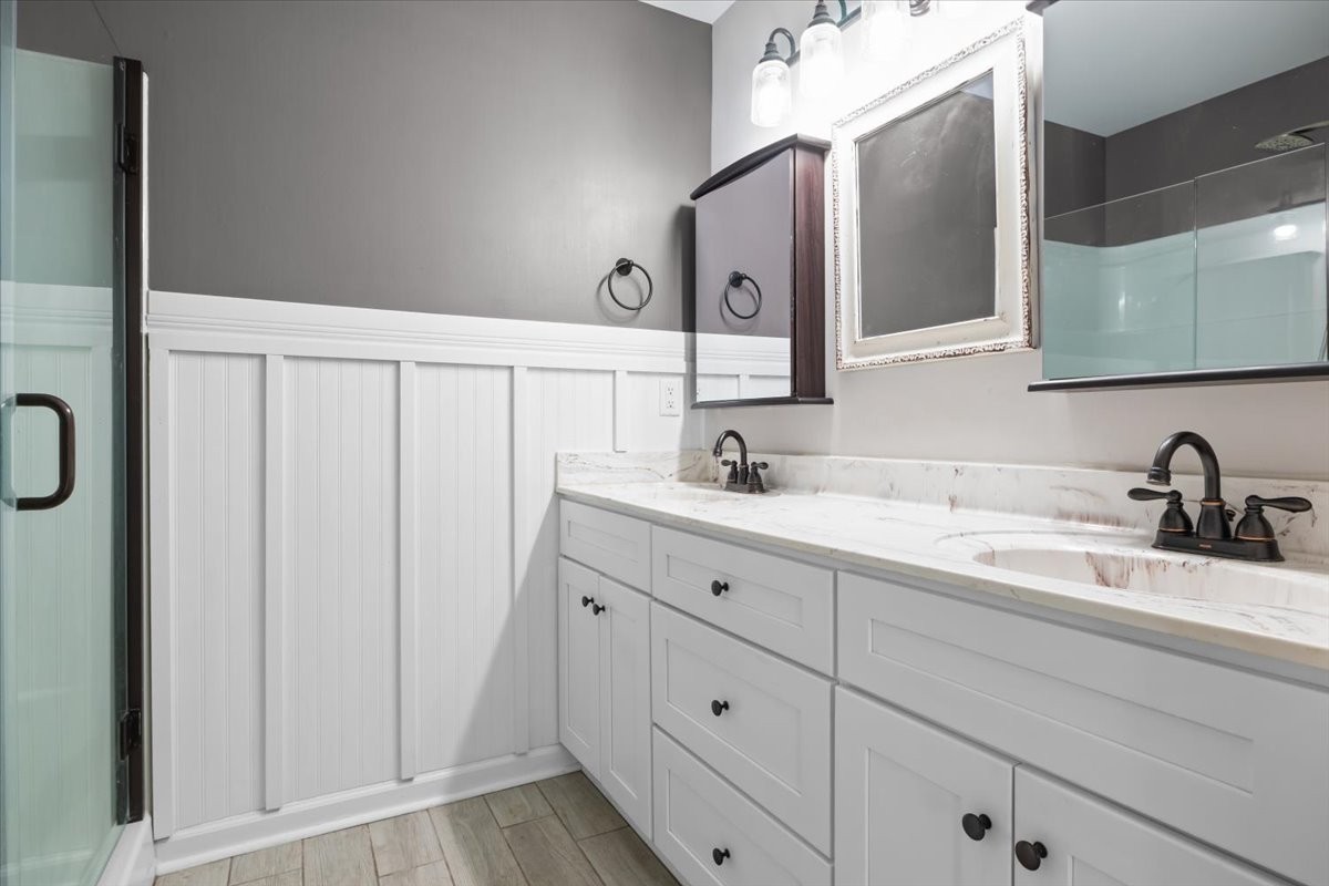 459 Diane Loop White Bluff, TN 37187 - Photo 16 of 35 a bathroom with a double vanity sink and mirror
