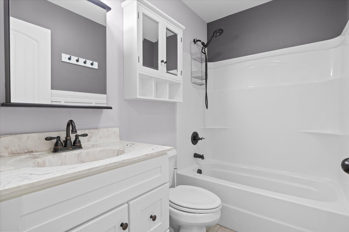 459 Diane Loop White Bluff, TN 37187 - Photo 21 of 35 a bathroom with a sink a toilet and a bathtub