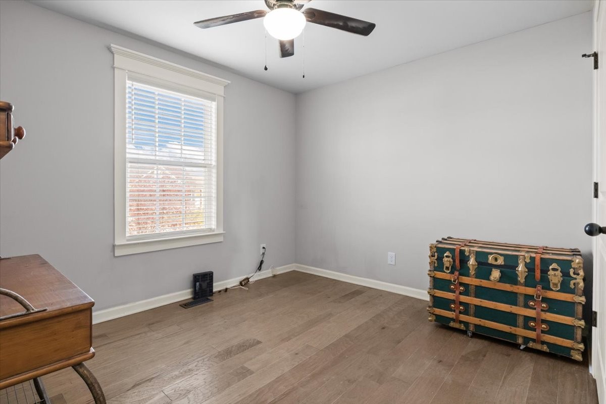 459 Diane Loop White Bluff, TN 37187 - Photo 22 of 35 a room with a baby bed a couch and a chandelier