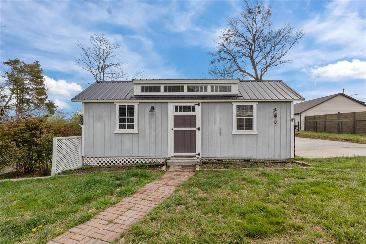 459 Diane Loop White Bluff, TN 37187 - Photo 31 of 35 a front view of a house with a garden