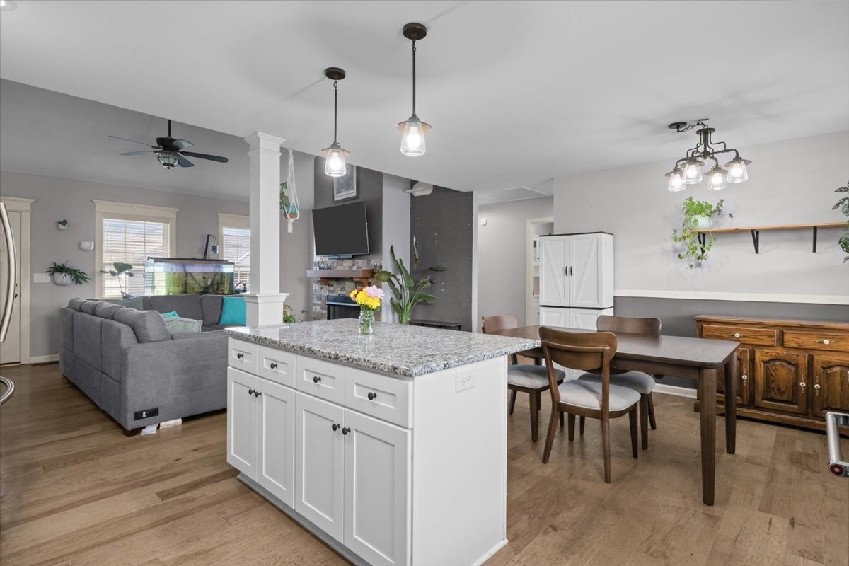 459 Diane Loop White Bluff, TN 37187 - Photo 10 of 35 a kitchen with stainless steel appliances kitchen island granite countertop a table chairs and a refrigerator