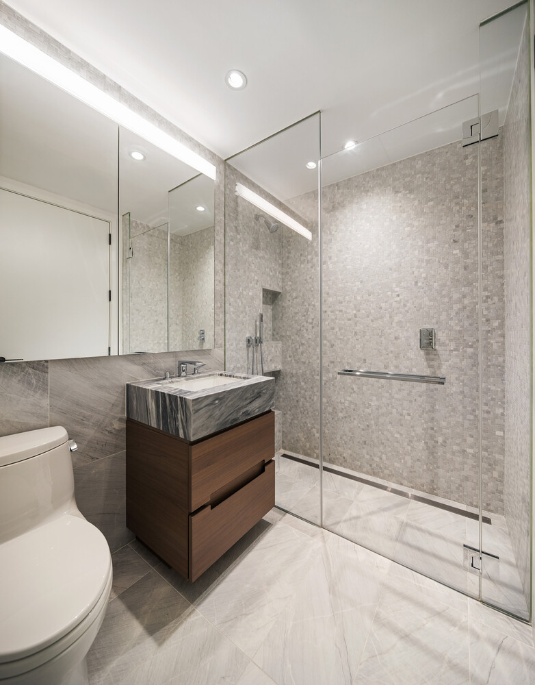 30 Riverside Boulevard, Unit 33A Manhattan, NY 10069 - Photo 15 of 17 a bathroom with a sink a toilet and shower