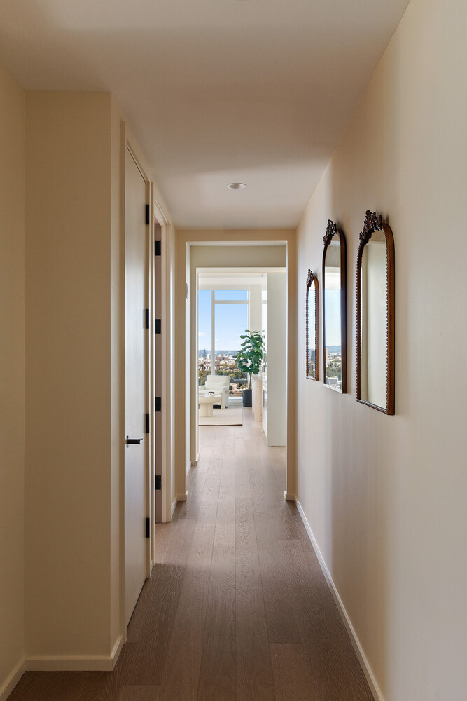 30 Riverside Boulevard, Unit 33A Manhattan, NY 10069 - Photo 6 of 17 a view of a hallway with wooden floor and a living room