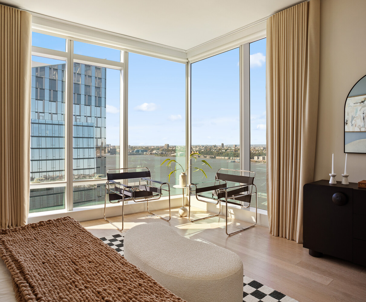 30 Riverside Boulevard, Unit 33A Manhattan, NY 10069 - Photo 8 of 17 a view of a living room with furniture and floor to ceiling window