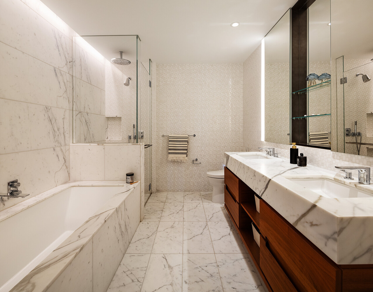 30 Riverside Boulevard, Unit 33A Manhattan, NY 10069 - Photo 9 of 17 a bathroom with a tub sink and mirror