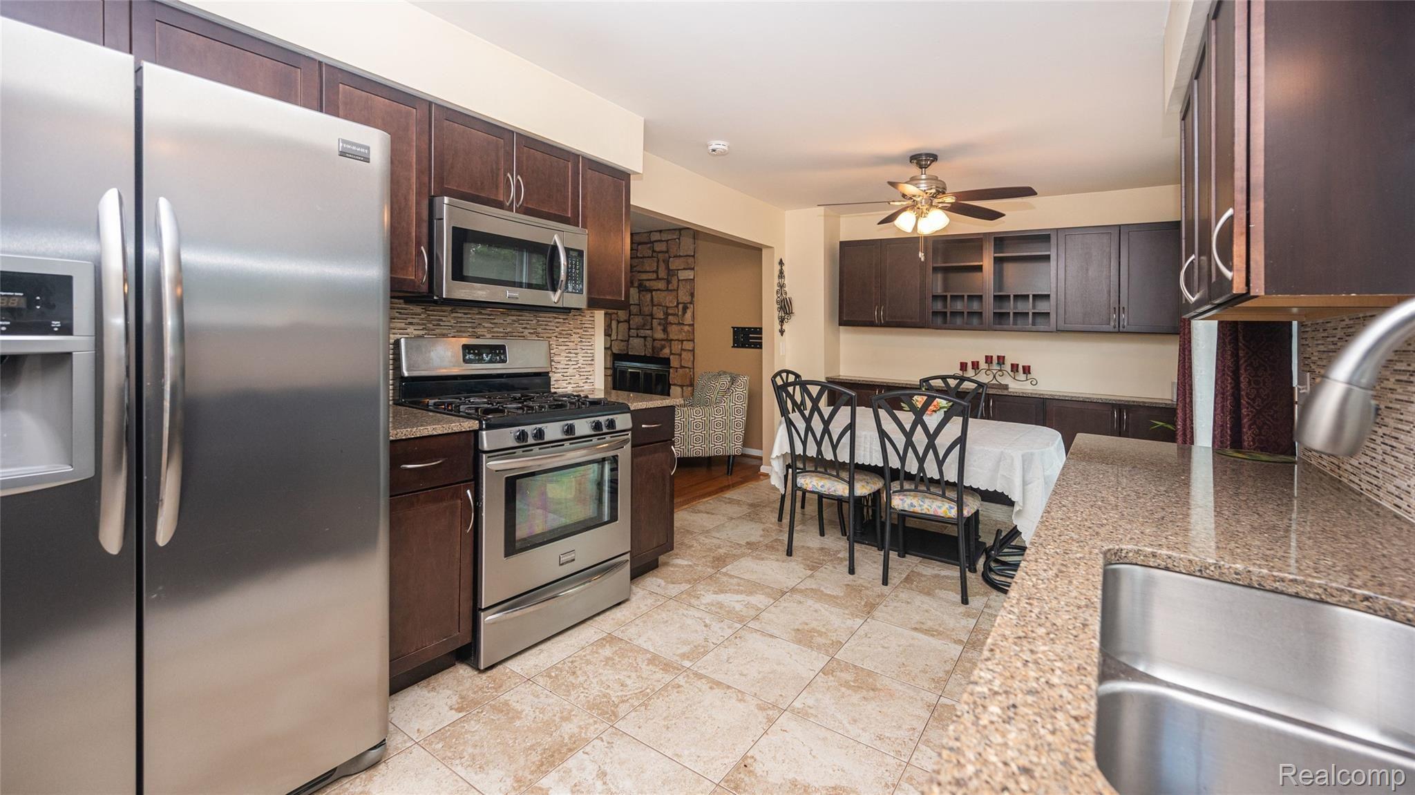101 Dalton Drive Rochester, MI 48307 - Photo 2 of 44 Updated kitchen with maple cabinets and ceramic flooring