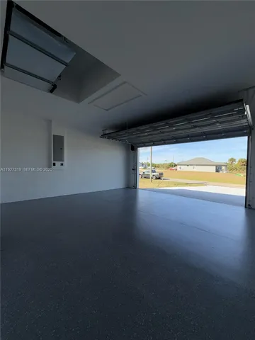 a view of an empty room and a window