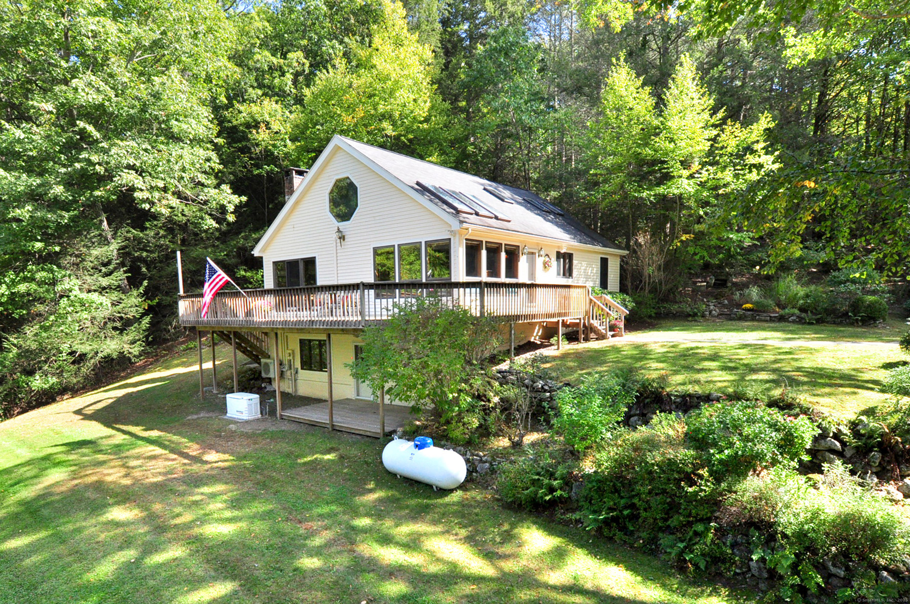 391 Cherry Brook Road Canton, CT 06019 - Photo 1 of 1 a front view of house with yard and green space