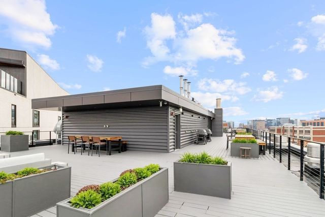 a view of roof deck with patio
