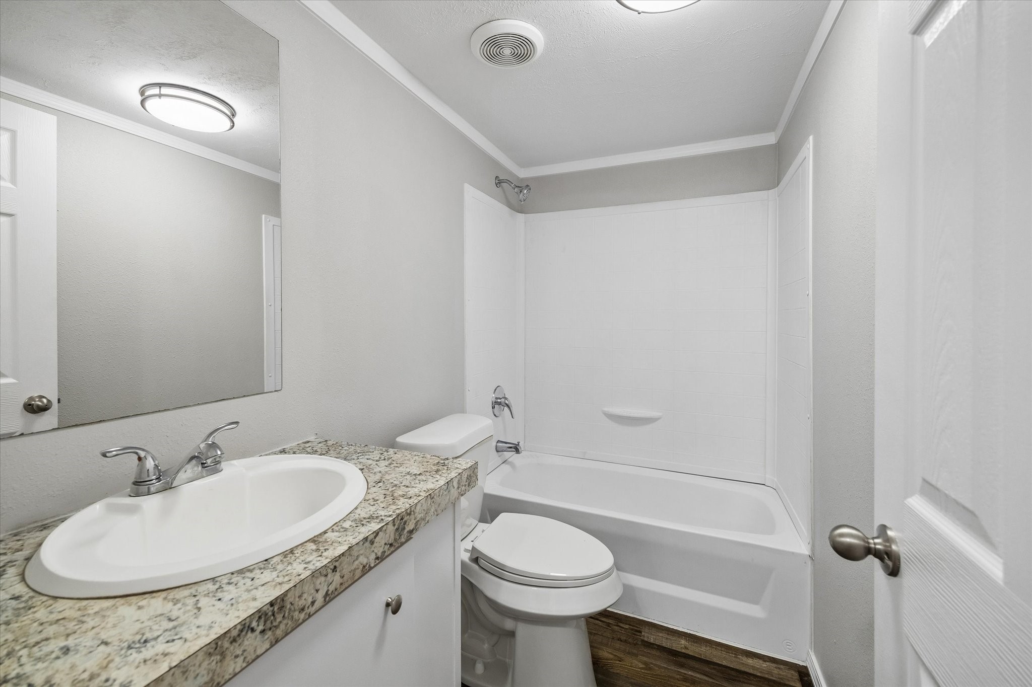 30 Timm Cleveland, TX 77327 - Photo 9 of 10 a bathroom with a granite countertop sink toilet a mirror and shower