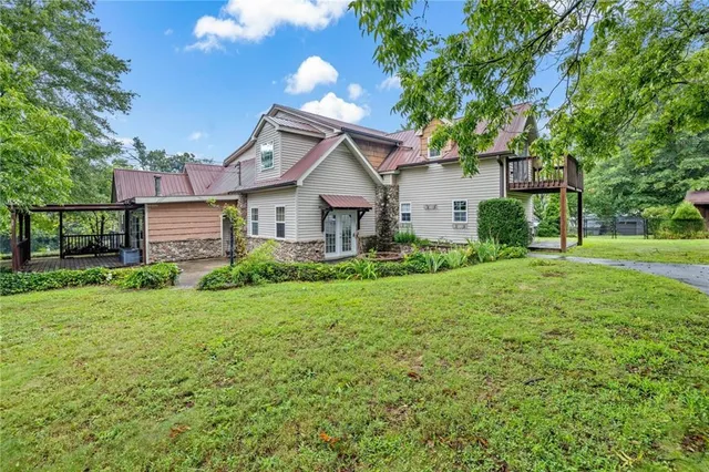 a front view of a house with garden