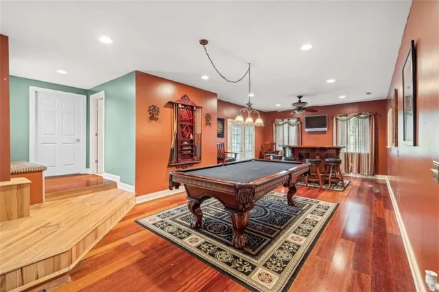 a view of a livingroom with furniture window and wooden floor