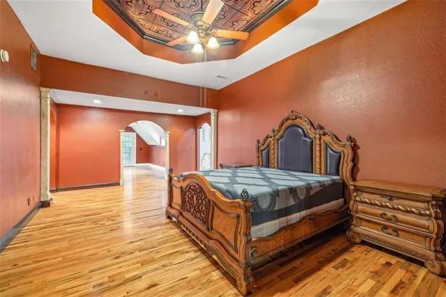 a bedroom with a bed and a view of en suite bathroom