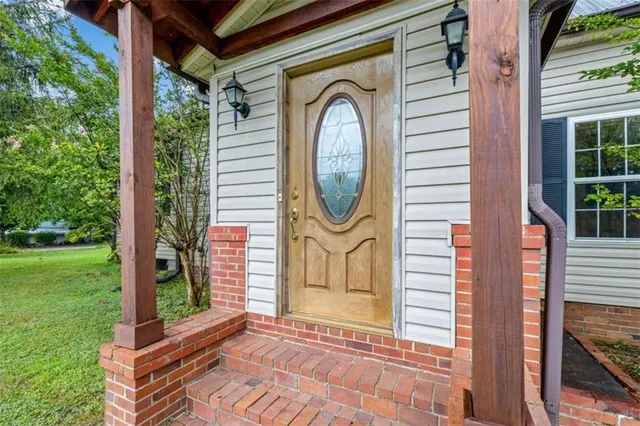 a front view of a house with garden