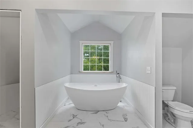 a view of a balcony with wooden floor and staircase