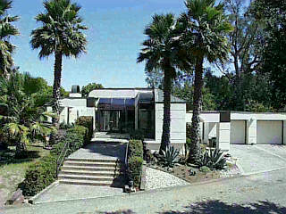 250 Las Alturas Road Santa Barbara, CA 93103 - Photo 1 of 1 a view of house with patio outdoor seating and covered with trees