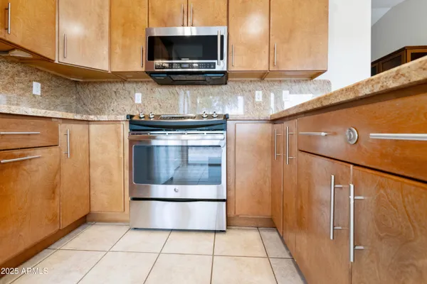 a kitchen with a stove and a microwave