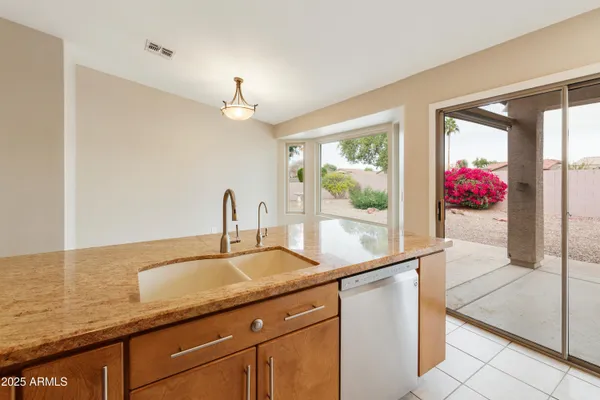 a kitchen with sink and window