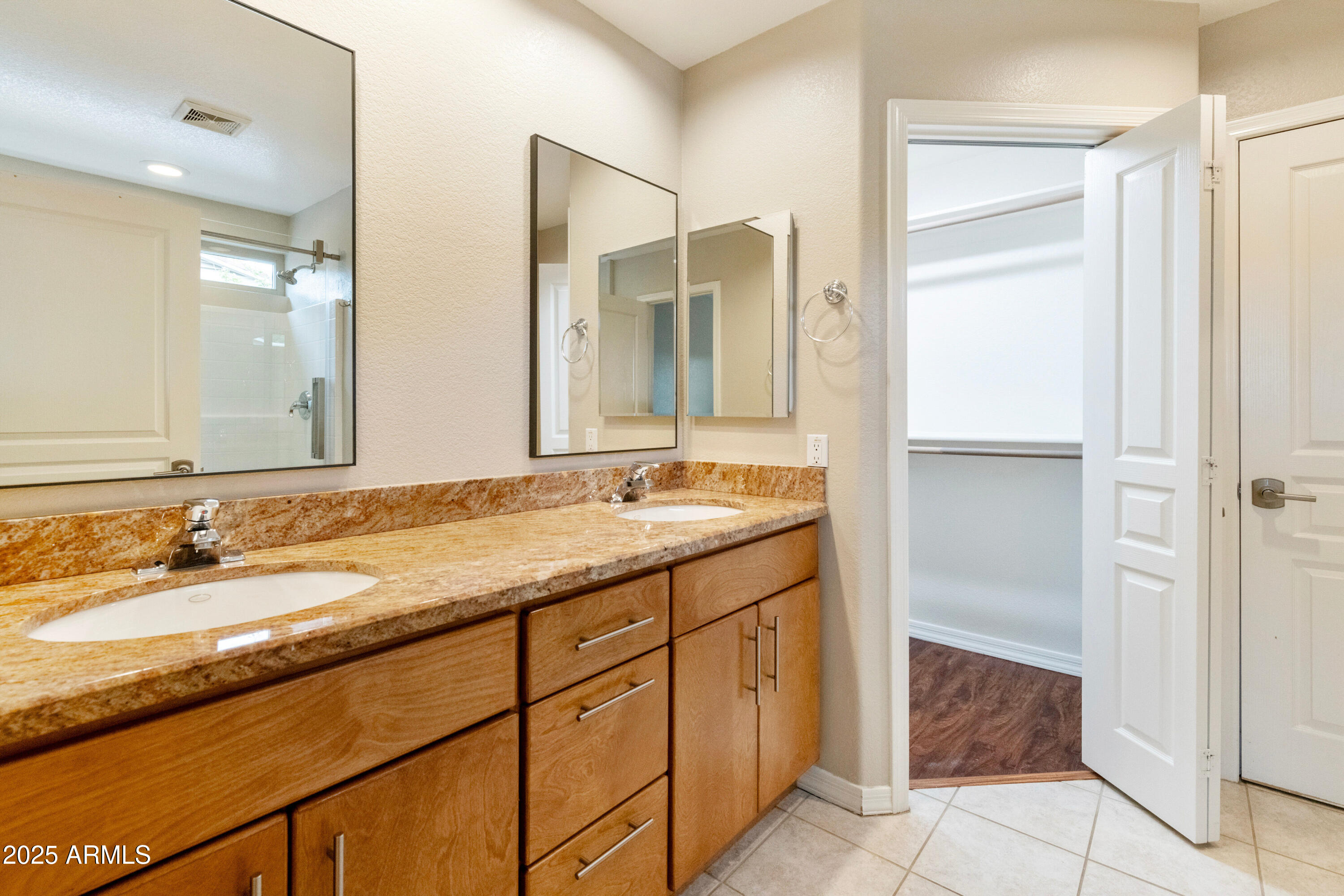 4300 East Cassia Lane Gilbert, AZ 85298 - Photo 21 of 54 a bathroom with a granite countertop sink and a mirror