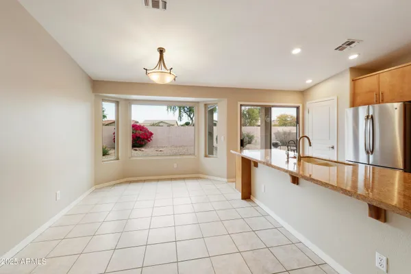 a view of an entryway with cabinet and a window
