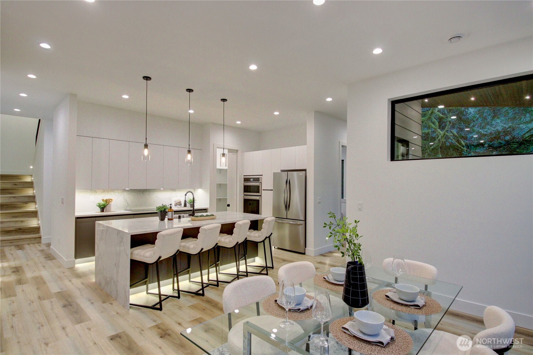 3 Cayuse Court Bellingham, WA 98229 - Photo 11 of 40 a large dining room with stainless steel appliances a table and chairs