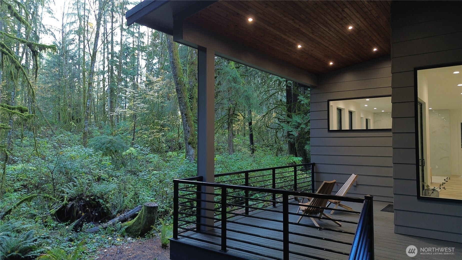 3 Cayuse Court Bellingham, WA 98229 - Photo 14 of 40 a view of a balcony with wooden floor and outdoor seating