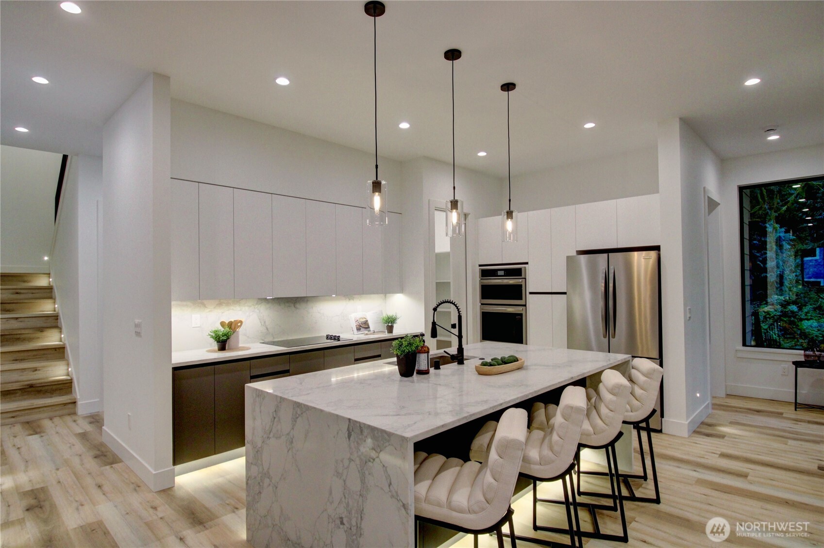 3 Cayuse Court Bellingham, WA 98229 - Photo 20 of 40 a kitchen with a table chairs refrigerator and microwave