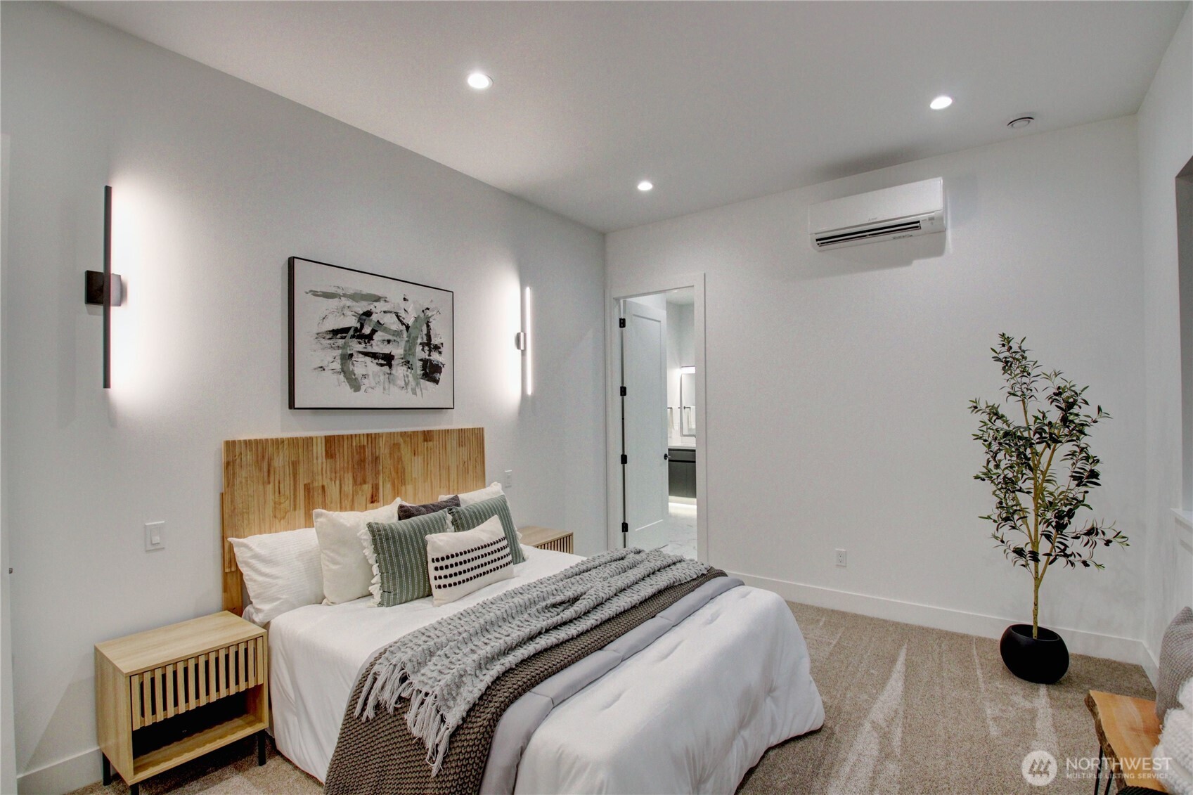 3 Cayuse Court Bellingham, WA 98229 - Photo 26 of 40 a bedroom with a bed and a potted plant