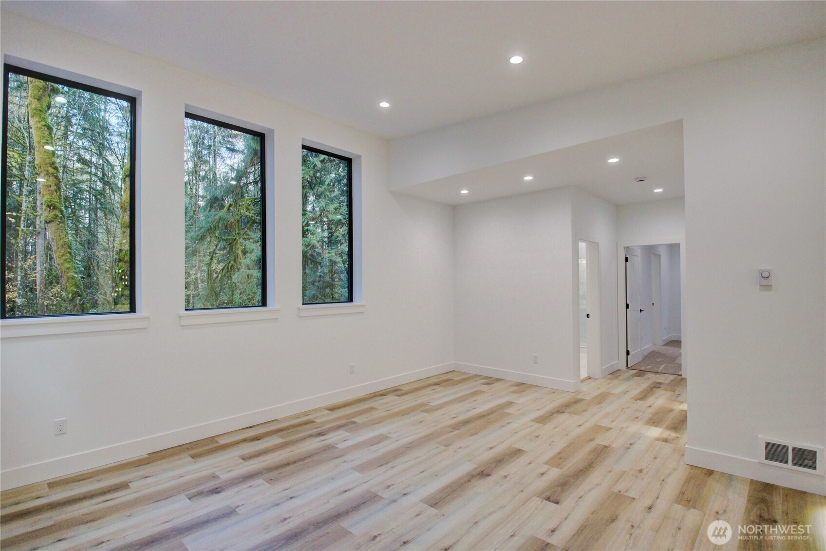 3 Cayuse Court Bellingham, WA 98229 - Photo 36 of 40 a view of an empty room with wooden floor and a window