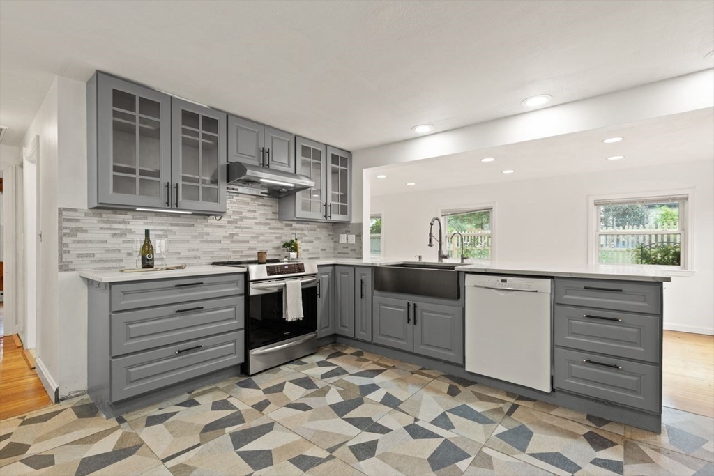 8 Margaret Road Sharon, MA 02067 - Photo 13 of 32 a kitchen with granite countertop white cabinets and appliances