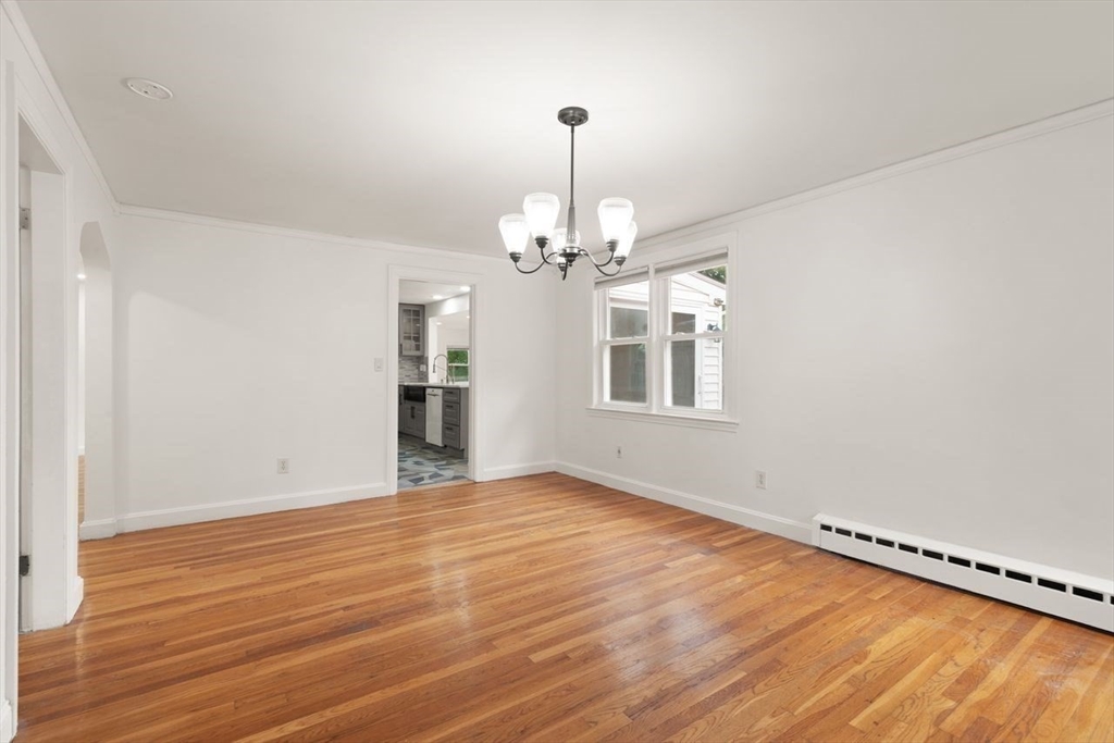8 Margaret Road Sharon, MA 02067 - Photo 20 of 32 wooden floor in an empty room with a window