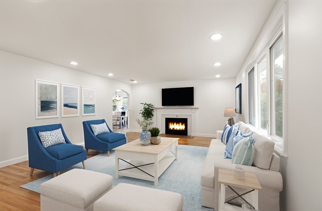 8 Margaret Road Sharon, MA 02067 - Photo 3 of 32 a living room with furniture wooden floor and a fireplace