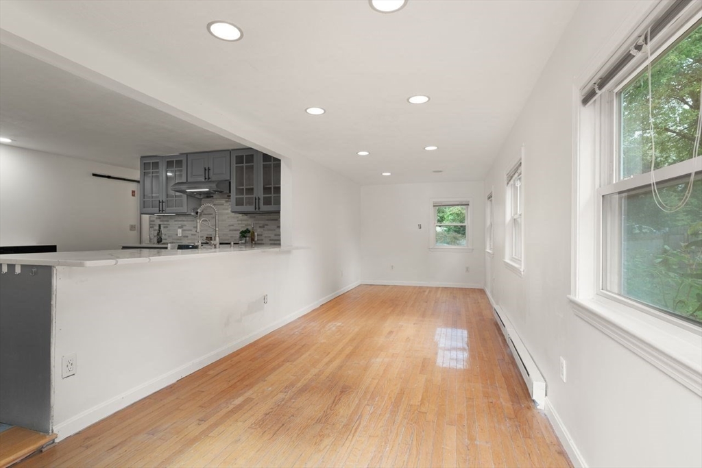 8 Margaret Road Sharon, MA 02067 - Photo 10 of 32 wooden floor in an empty room with a window