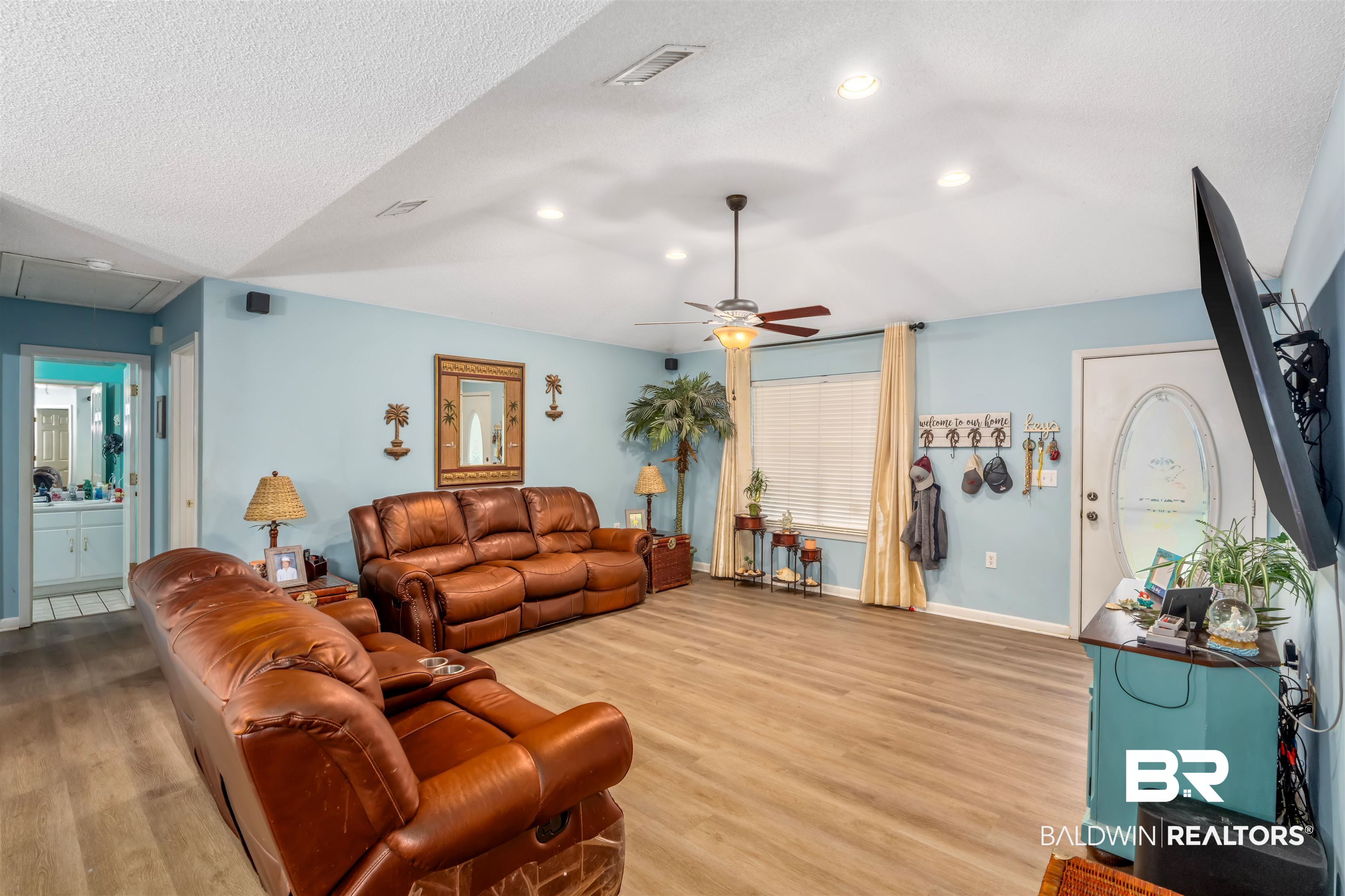 23186 Pecan Street Robertsdale, AL 36567 - Photo 9 of 36 Living area featuring light wood-style floors, attic access, a textured ceiling, ceiling fan, and recessed lighting