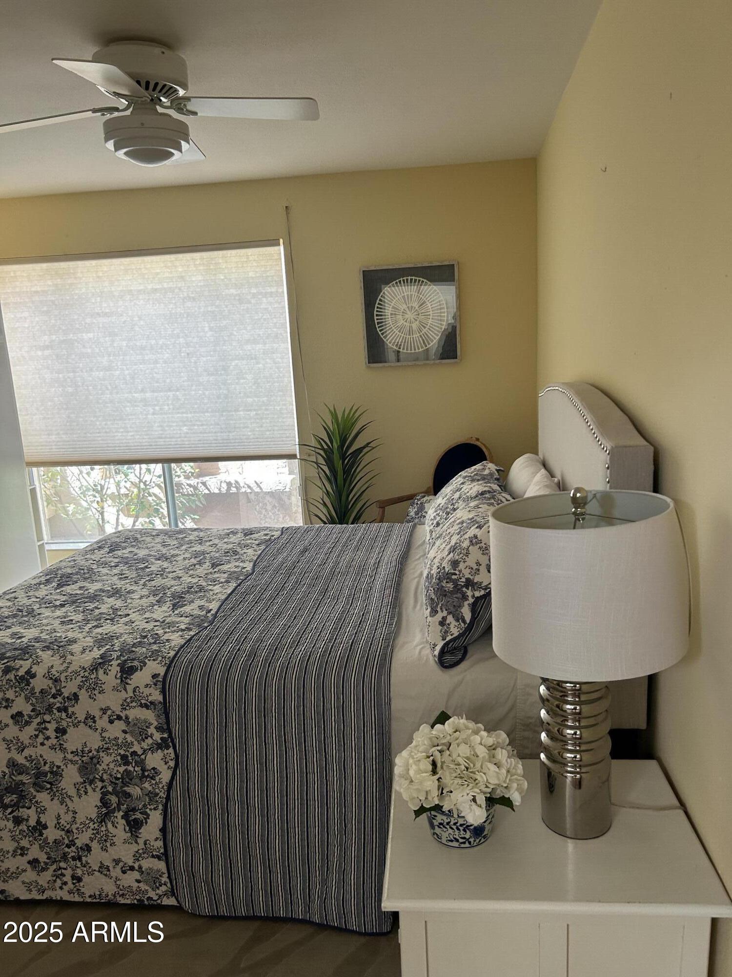25828 North Primo Circle Rio Verde, AZ 85263 - Photo 12 of 21 a bedroom with a bed and a window