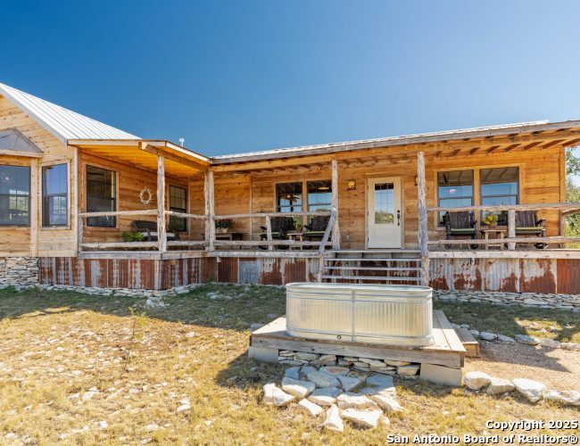 a swimming pool view with a outdoor seating